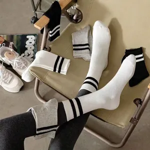 Set of black, white and grey cotton mid-calf socks with classic double stripes