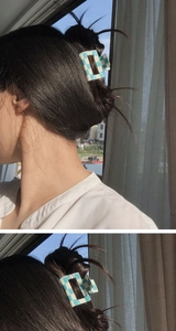 Blue and white checkered square hair claw clip styled on a woman's bun hairstyle