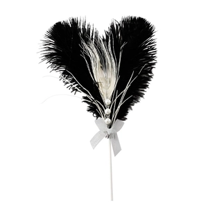 Elegant natural ostrich feather heart cake topper with pearls and silver bow on white background