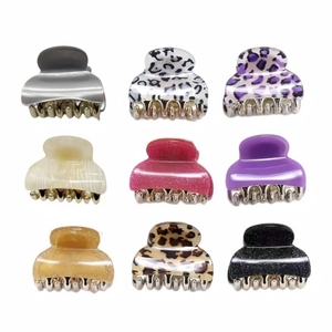 Set of 9 stylish acrylic leopard print hair claws in various colors and patterns