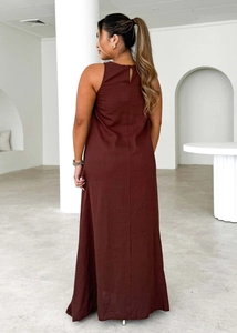 Back view of a minimalist deep brown sleeveless maxi dress with an elegant back slit