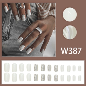 Short square press-on nails with white marble hill pattern and 3D textured design