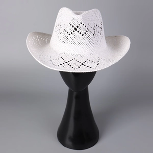 Detailed view of white hollow-out woven cowboy straw hat on a display mannequin head