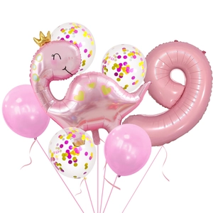 Pink crown dinosaur balloon set for girls 9th birthday party with confetti accents