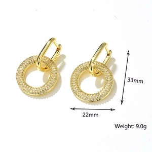 Detail view of gold hoop earrings with pave zircon, measuring 33mm in height and 22mm in diameter