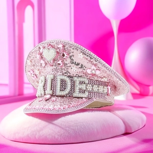 Detail of pink sequin captain hat with pearl and rhinestone BRIDE lettering for weddings