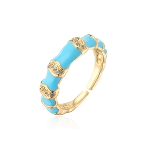 Detail of gold-plated bamboo-style ring with sky blue enamel and micro-set cubic zirconia