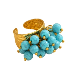 Bohemian adjustable gold ring with turquoise beads and hammered metal texture detail