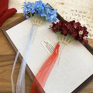 Elegant floral hair fork with long silk ribbons in vintage blue and red colors