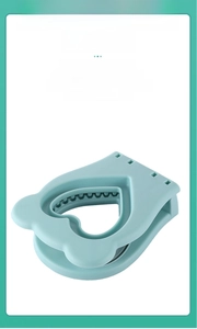 Detail showing blue heart sandwich mold with press design and adjustable damping lid