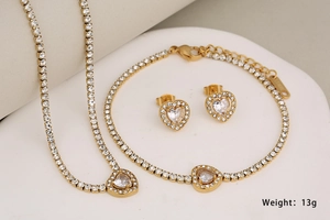 Detailed view of 13g gold heart jewelry set including necklace bracelet and earrings