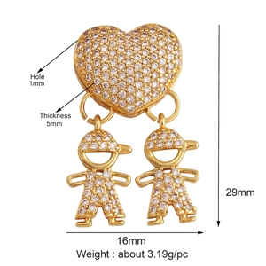 Detail view of gold-plated boy and girl pendants with micro-pave white zircon stones