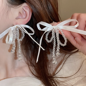 Elegant fabric bow earrings with clear glass bead tassels in white and gold finish