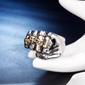 Vintage silver punk fist ring with gold skull and KFT 1 engraving on hand model