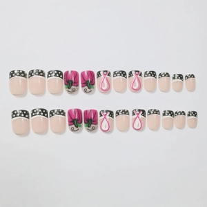 French dot and ribbon pattern press-on nail set with floral design in pink and black