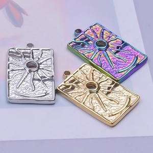 Detailed view of rectangular sunburst pendants in silver, gold, and rainbow finish
