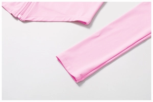 Makroaufnahme der rosa Sportjacke mit hochwertigen Nähten und glattem Reißverschlusssaum