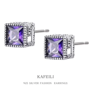 Close-up of vintage S925 silver square earrings with purple stones and ornate engraving