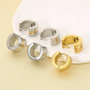 Minimalist C-shaped stainless steel hoop earrings in silver and gold with brushed finish