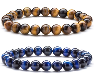 Detail showing natural tiger eye and blue tiger eye beaded bracelets with polished texture