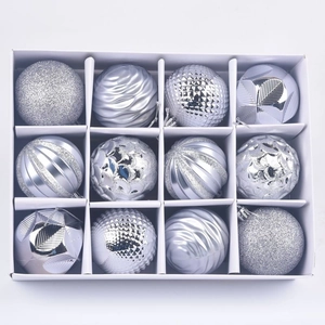 Detail of 12-piece silver Christmas ball ornaments with diverse textures in a grid box