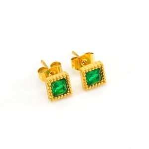 Detail shot of gold square stud earrings with green zircon stones on white background