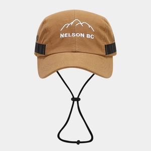 Detail of khaki outdoor camper cap featuring mountain embroidery and windproof cord