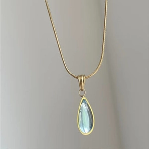 Vintage gold-plated snake chain necklace with a light blue teardrop pendant