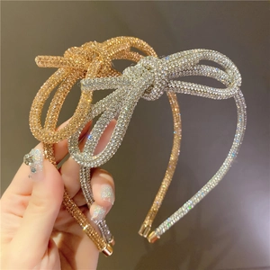 Sparkling crystal rhinestone bow headband for women in gold and silver finish