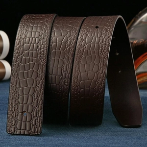 Dark brown genuine leather belt with crocodile pattern on blue denim background