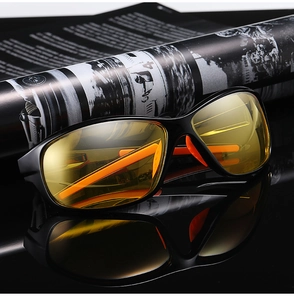 Detail of yellow night vision lenses with black frame and orange anti-slip temple pads
