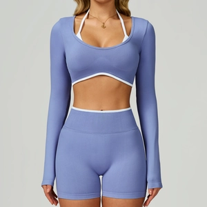 Detail of grey-blue seamless yoga set with long-sleeved crop top and high-waist shorts