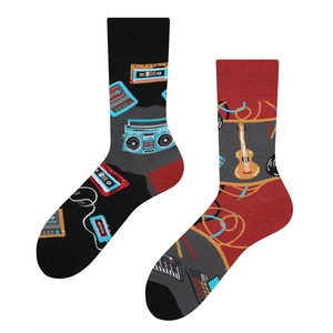 Detail of asymmetric music socks featuring retro cassette tape and guitar patterns