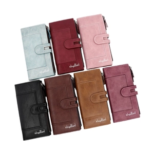 Set of seven faux leather long wallets for women with snap closure and zippers in diverse colors