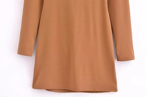 Detailed close-up showing the smooth texture and stitching of the brown long sleeve dress