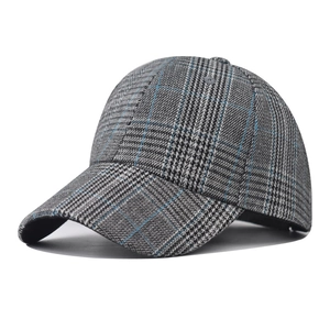 Macro detail of the classic grey and blue plaid embroidery on a baseball cap texture