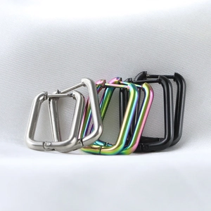 Three pairs of 10mm stainless steel U-shaped hoop earrings in silver, rainbow, and black