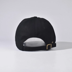 Detail of cotton baseball cap back with adjustable metal buckle and bronze eyelets