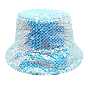 Macro view of light blue iridescent sequins on a double-sided sun bucket hat surface