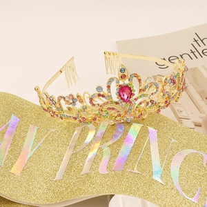 Detailed view of Birthday Princess glitter sash and gold tiara with colorful rhinestones