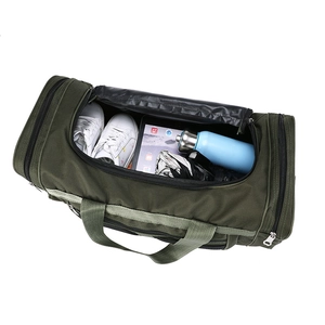 Top view of army green duffel bag showing interior capacity with shoes and essentials