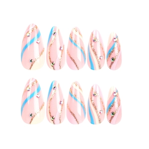 Almond press-on nails with pink base, blue swirls, gold glitter, and rhinestones
