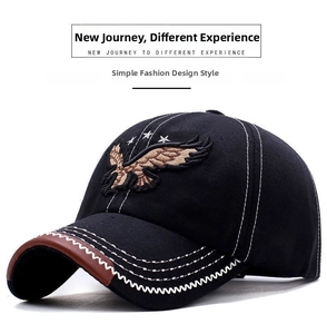 Detail of eagle embroidery and contrast stitching on a black canvas baseball cap