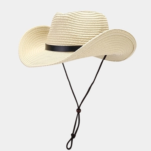 Detail of western straw hat featuring woven texture, black band, and adjustable chin strap