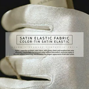 Elegant white satin bridal gloves with stretch fabric and glossy finish for wedding gown