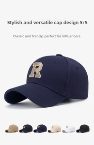 Detail of multi-color baseball caps with 3D gold R letter embroidery on structured crown