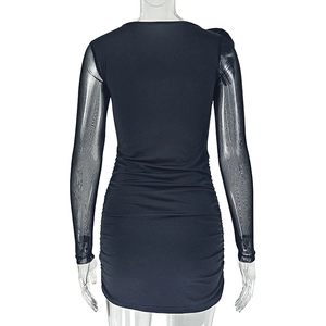Detail of the sheer mesh sleeves and ruched back design on this black bodycon dress