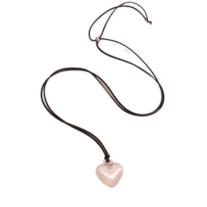Adjustable long necklace with a matte pearlescent pink heart pendant on black cord