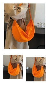 Detailed views of a bright orange nylon crescent crossbody bag showing its large capacity