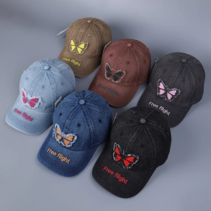 Multiple colors of washed denim baseball caps with butterfly and letter embroidery